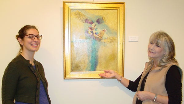 Montevallo Arts Council Board members Elizabeth Pellathy and Suzanne Hurst discuss one of Langley Tolbert’s abstracts. (contributed)