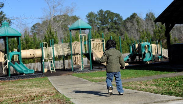 Elijah Seritt runs toward a Chelsea playground in early January. (Reporter photo/Jon Goering)