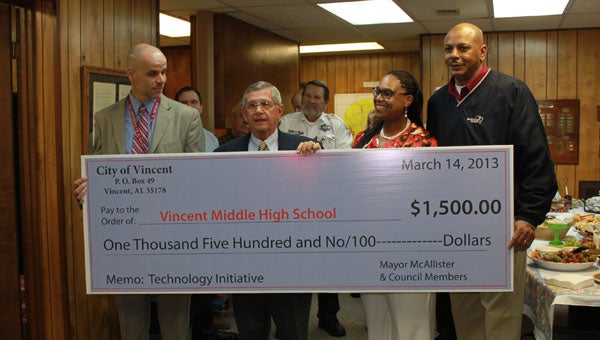 VHS Principal Joel Dixon receives a check from Vincent Mayor Ray McAllister and Council members Bridgette Jordan Smith and Bruce Hamilton. (Reporter photo/Christine Boatwright)