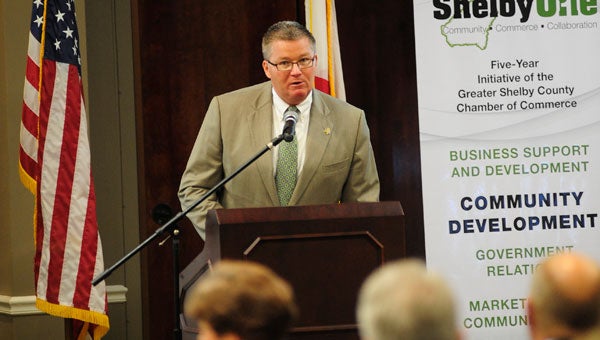 Greater Shelby Chamber of Commerce President Kirk Mancer unveils the chamber's Shelby One campaign during a 2012 GSCCC luncheon at the Pelham Civic Complex. (Photo by Jon Goering)