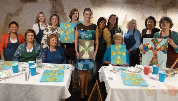At the Vignette Spring Fling held at Bernie’s, Jaime Brooks poses with Vignettes holding their paintings instructed by Trina Stogner. From left are Ann Handley, Linda Major, Samantha Rush, Dolores Jones, Pam Oliver, Linda Whitley, Brooks, Stogner, Tresa House, Phyllis French, Chanda Jennings, Lynn Cox and Vignette President Barbara Robinson. (contributed)