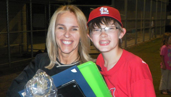 For love of the game: Bishop (pictured with his mother, Lori) gave up playing baseball and became a manager for Coach Craig Pearce and the Cardinals. 