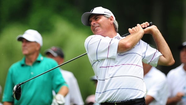 Fred Couples watches a drive in Round 1 of the Regions Tradition at Shoal Creek.