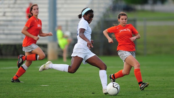Oak Mountain's Toni Payne, above, and Chandler Stroupe are the 2013 All-County Soccer Players of the Year.