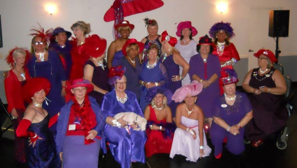Red Hat Society members dressed in their finest for a dinner and dance held Aug. 21 at Calera Elks Lodge. (contributed)
