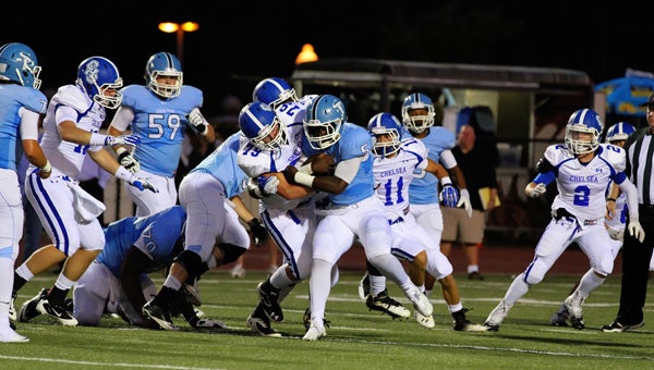 Chelsea's Shane Sibert tries to pull down Spain Park's Otis Harris in a Sept. 13 matchup at Spain Park. (Contributed/Cari Dean)