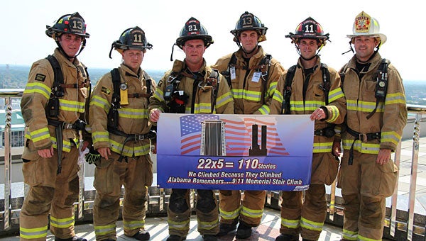 Alabaster firefighters, from left, Chad Trautwein, Zach Cruce, Chase Smith, Calem Hicks, Nathan Smitherman and Fire Chief Jim Golden atop the RSA Tower in Montgomery. (Contributed)
