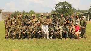 Buford Boone, center, wearing white, recently led a sniper school in Tuscaloosa including several local law enforcement officers. (Contributed)