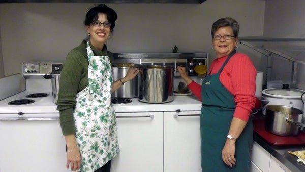 Dolly Davis and Sylviane Price prepare soup for the annual soup supper at Montevallo First United Methodist Church. (Contributed)