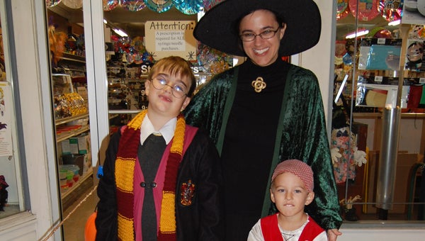 Thomas Reed, Leanne Pearce Reed and Adam Reed dressed as Harry Potter, Professor McGonagall and a pirate for Art Walk. (Reporter Photo/Stephanie Brumfield)