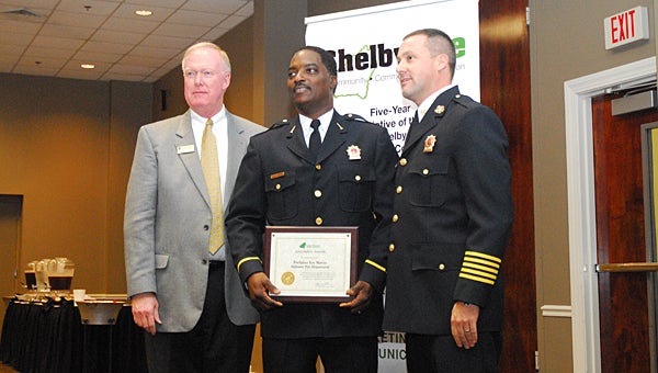 Eric Marcus, center, was named the Alabaster Firefighter of the Year during the annual Safety Awards Luncheon at the Pelham Civic Complex on Oct. 30. He is joined by Alabaster Fire Chief Jim Golden, right, and Greater Shelby County Chamber of Commerce Chairman David Nolen, left. (Reporter Photo/Neal Wagner)