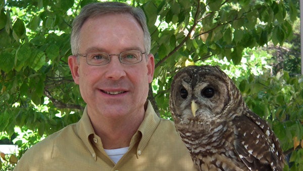 Alabama Wildlife Center Executive Director Doug Adair with one of the glove-trained education birds, Coosa, a Barred Owl. (contributed)