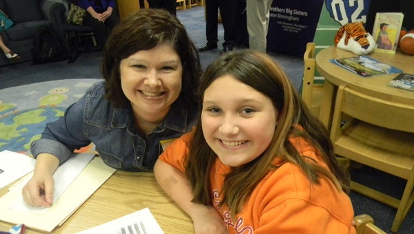 EBSCO employee Ashley Buchanan with her Little, Skyler, a student at Vincent Elementary. (Contributed)