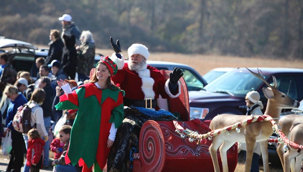 Santa and his elf, Alex Carpenter, make an apperance during a previous Chelsea Christmas Parade. This year's parade is set for Dec. 21. (Contributed/Cari Dean)
