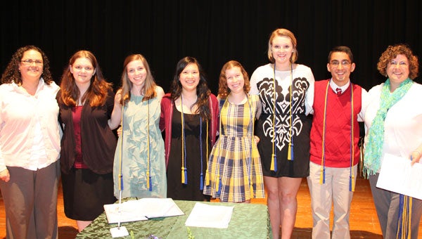 Lisa Essman, left, and Tonya Hatch, right, surround Pelham High School's National English Honor Society officers. (Contributed)