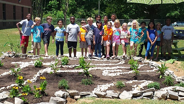 Creek View Elementary School students recently helped build a butterfly garden at the school. (Contributed)