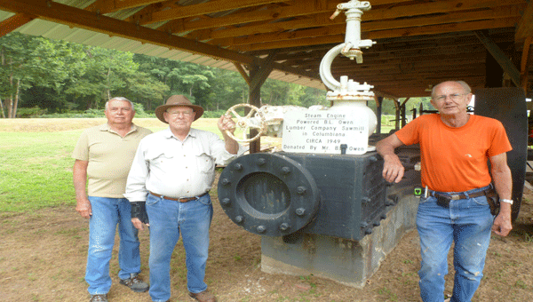 Historic Shelby Association, Inc.'s member Harry Burks, Historian Jerry Willis and President Tom Trimble stand next to on of the Shelby Iron Parks steam engines as they plan for the fall festival Oct. 11-12. (Contributed)