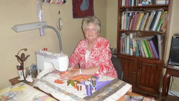 Agnes Pool, shown quilting at her sewing machine, will have a book signing for her two quilting books at the Shelby County Museum on Oct. 11. (Contributed)