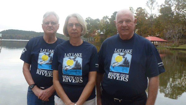 Photo: Lay Lake HOBO Secretary Frank Jones, Water Monitoring and Cleanup Chair Judy Jones and President Art Giddens in front of Lay Lake will host the 17th annual meeting at the Childersburg Rec Center on Oct. 11 at 10:30 a.m. (Contributed)