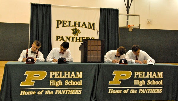 Hunter Stovall, Tyler Wilburn, Connor Radcliff and Sam Finnerty at a Nov. 13 signing ceremony at Pelham High School. (Reporter Photo / Molly Davidson)