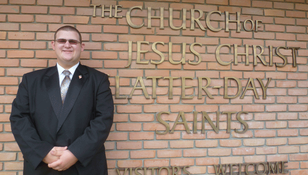 Elder Andrew Melsen, who is serving for two years in Arizona as an LDS missionary, stands in front of his church, the Columbiana Ward of the Church of Jesus Christ of Latter-day Saints.