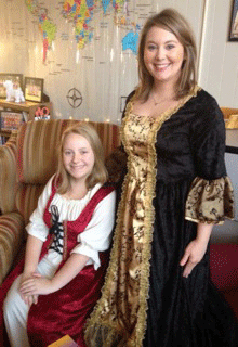 Pictured is history teacher Jordan Pritchett and ninth grader Grace Stermer, dressed in character to participate in an 18-century style salon.