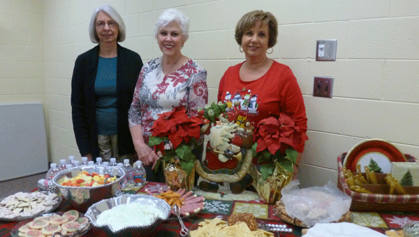 FOL members Judy Jones, Sarah Atchison and Linda Major at the FOL Christmas lunch and ornament swap. Atchison is chair of the Book/Bake Sale this spring. (Contributed)