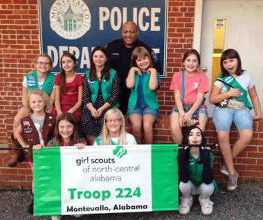 Pictured are members of Girl Scout Troop 224 with Lt. Alexander of the Montevallo Police Department after a recent tour of the police station. (Contributed)