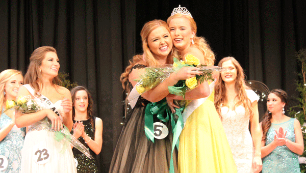 Life-long friends third alternate Kayla Waters and Miss PHS 2015 Presley Scherer celebrate with a hug. (Contributed)