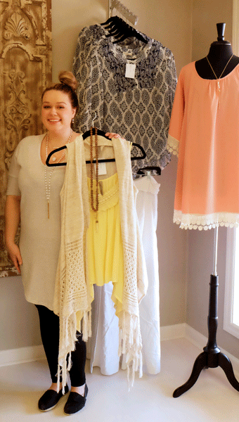 Jordan Gable, store manager at The Ivory Orchid in their new location at 4035 Helena Road, shows arriving spring looks. (Contributed)