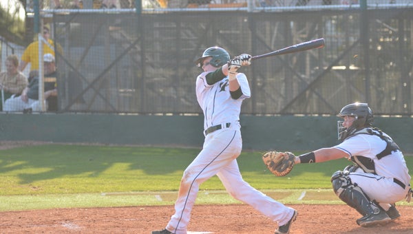 Chase Martin takes a cut at a ball in an earlier game this year against Helena. Martin helped lead Pelham to a 9-0 victory over Regis Jesuit in the IMG National Classic on March 30 in Bradenton, Fla. (File)