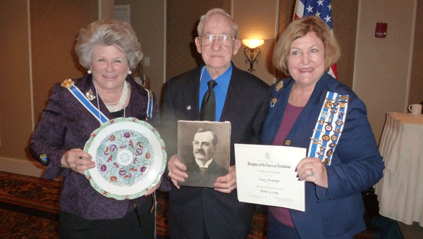 Henry Emfinger received the DAR Community Service Award at the recent state conference for the historical preservation of Alabama's coal mining industry at the Aldrich Coal Mining Museum in Shelby County. State Regent Connie Grund, step-great granddaughter of Truman Aldrich, owner of the Aldrich Coal Mine, presented Emfinger a portrait of Aldrich and plate owned by Aldrich for the museum. Pictured are Grund, Emfinger and Community Service Chair Martha Ann Whitt. (Contributed)
