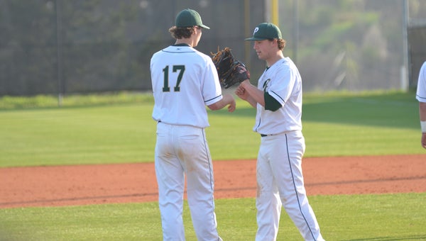 Hunter Orr gives an encouraging word to Sam Finnerty in an early-season game. Finnerty and the Pelham baseball Panthers thrasehd Jackson Olin 38-1 over the course of two games on April 6. (File)