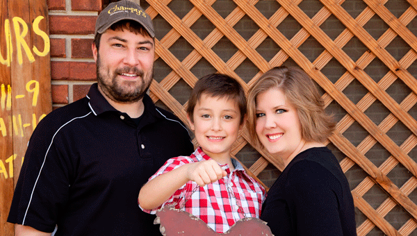 Sterling Gros, left, and Whitney Henson, right, own and operate Champy's restaurant in Alabaster. They are pictured with their son, Avery. (Contributed)