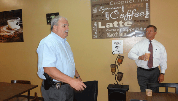 Pelham Police Chief Larry Palmer speaks to people at a South Shelby Chamber of Commerce event at Kai's Koffee House on May 12. (Reporter Photo/Emily Sparacino)