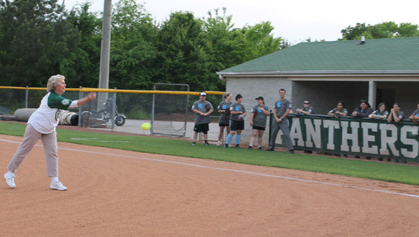 Judy Hayes throws out first pitch in the first Pelham High School versus Helena High School Faculty softball game. (Contributed)