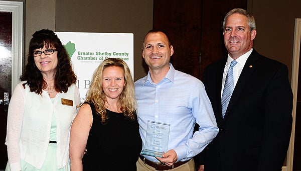 Encore Resales owners Marina Carey and Michael Carey, center, join Chamber Chairwoman Lisa McMahon and Brook Balough with Regions Bank as Encore receives a Small Business of the Year award on May 20. (Reporter Photo/Neal Wagner)