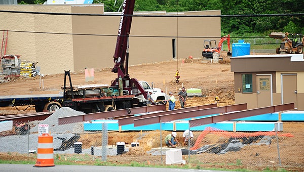 Construction crews work to build the new Walmart Neighborhood Market off Alabama 119 in Alabaster in late May. The majority of the structure is now completed. (File)