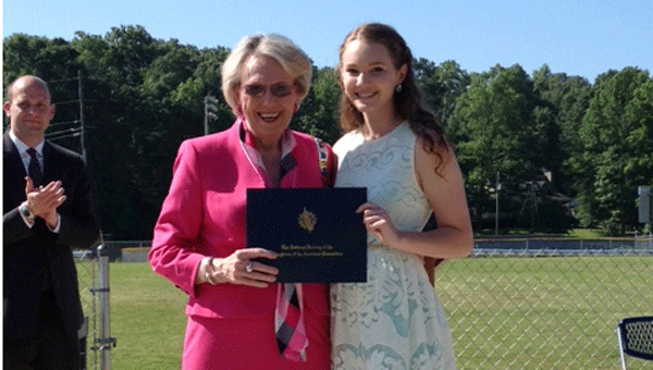 National Defense Chair Beverly Hall, member of the David Lindsay Chapter of the Daughters of the American Revolution, presents Sara Mae Blevins with the DAR Good Citizenship Award. Blevins is an eighth grade student at Chelsea Middle School. (Contributed) 