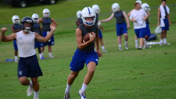 A Chelsea receiver gets past an Oak Mountain defender on June 25 at Chelsea High School. The two schools met at Chelsea to practice against each other and play 7-on-7. (Reporter Photo / Baker Ellis)