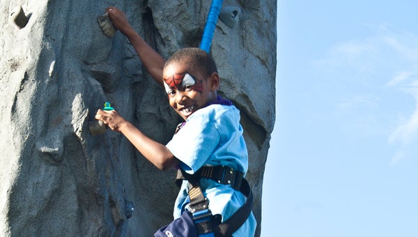 St. Vincent's One Nineteen celebrated 10 years of promoting wellness in the community with a block party and health festival on Saturday, June 13. Rock climbing was just one of the many fun, family-friendly activities offered during the event. (Special to the Reporter / Joanna Lea)
