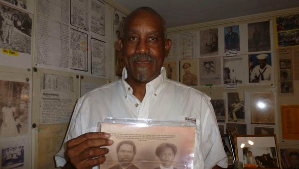 Albert Baker Datcher, Jr. known as Pete, holds the picture of his slave great-grandparents, Albert and Lucy Baker, in the Harpersville home where six generations of his family have lived including great-grandmother Lucy Baker. The house is a museum of memorabilia and artifacts of black Shelby County families from slavery to present day. (Contributed)