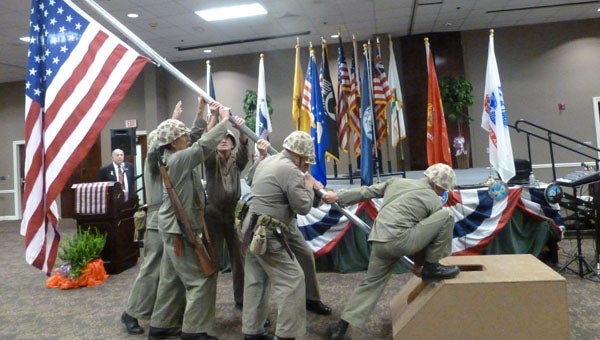 The Howlin' "Mad" Smith Detachment of the Marine Corps League reenacted the iconic Joe Rosenthal's Iwo Jima photograph narrated by Cahaba Valley Elks Lodge 1738 member John Gaydon at the Seventh Annual Flag Day Patriotic Celebration, sponsored by the City of Pelham and the Cahaba Valley Elks Lodge 1738. (Contributed)