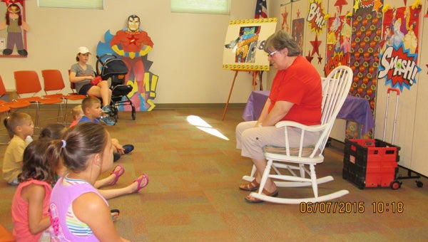 Ms. Jennie Bunton, storyteller, visits with a group at the library. (Contributed)