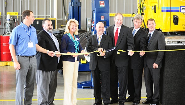 Alabaster officials join Penske corporate leaders during a July 24 ribbon-cutting ceremony at the company's new Alabaster location in the Dunn Corporate Park. (Reporter Photo/Neal Wagner)