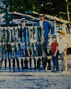Charles Griffin (middle) is seen here in this 1968 photo with his family and numerous Redhorse fish. (Contributed)