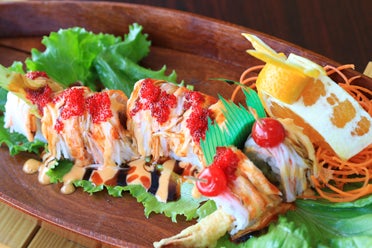 One of Pinto Thai's specialties is the Red Dragon Roll, a sushi dish with shrimp tempura, spicy tuna and crab meat, with red Tobiko and cherries for the dragon's eyes. (For the Reporter/Dawn Harrison)