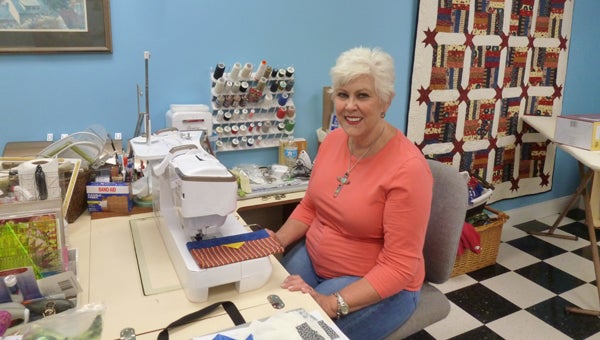 Sarah Atchison will lead sewing and craft classes every Wednesday at the new Columbiana Senior Center from 8 a.m.-4 p.m.. The ribbon cutting and grand opening of the center will be Friday, Oct. 2 at 10 a.m. with reception following till noon. The public is invited. Pictured is Atchison in her sewing room. (Contributed)