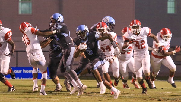 Calera's Kyle Harrell breaks a run into the Central-Tuscaloosa secondary during Calera's 39-29 win on Sept. 11. (For the Reporter / Dawn Harrison)