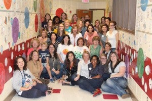 Inverness Elementary School faculty pose in the school's dot-themed hallway on International Dot Day. (Contributed)